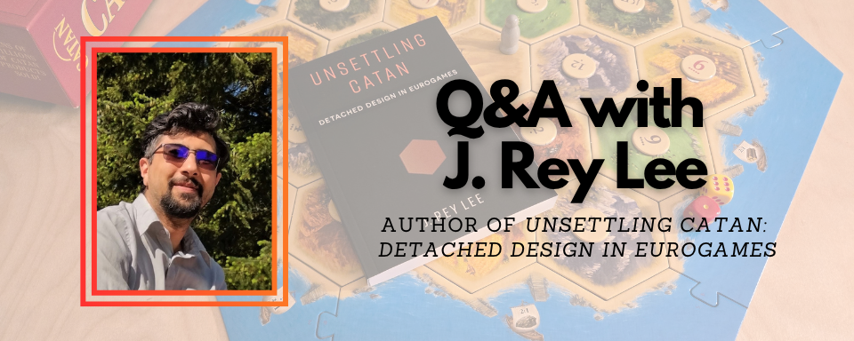 Photo of a man with the blog title overlaying a photo of a book and board game